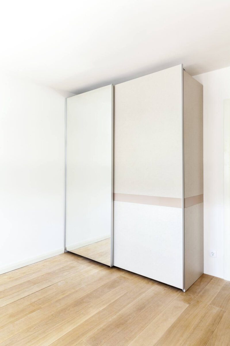 wardrobe with mirror in an empty room