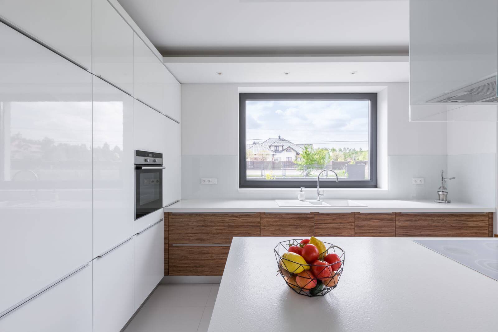 Modern design, white kitchen with island and big window
