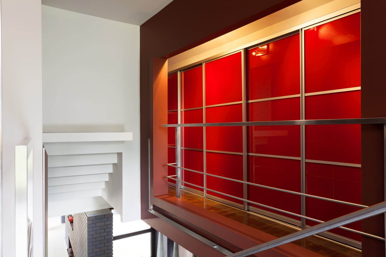 A moder red wardrobe area on the first floor