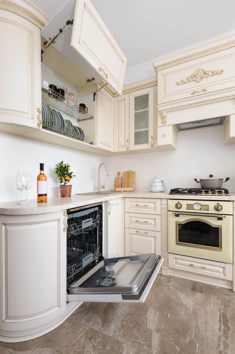 Modern spacioius beige colored luxury kitchen, dishwasher door open