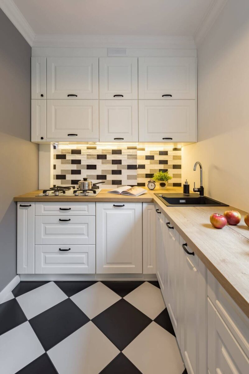 Small kitchen with modern black and white floor tiles
