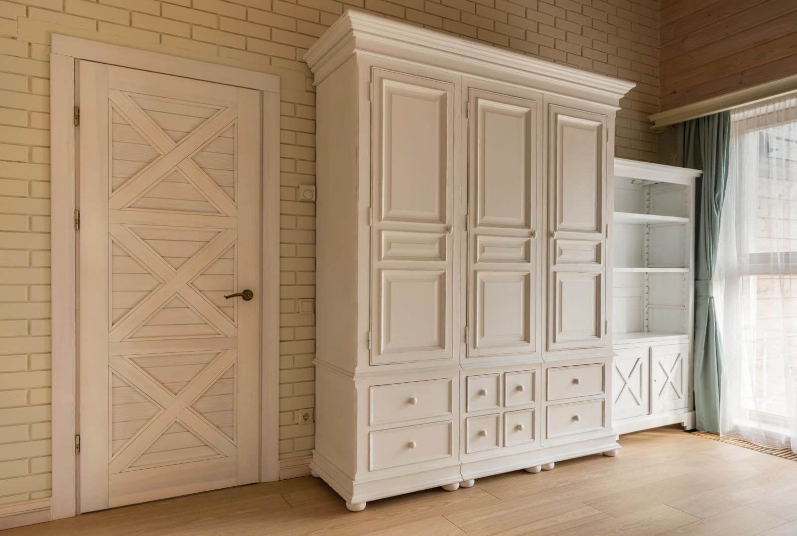white classic wooden wardrobe in cottage house