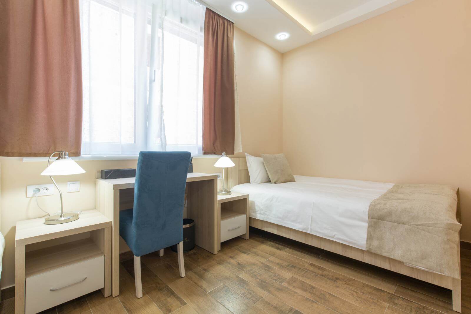 Hotel room interior, beige bedroom