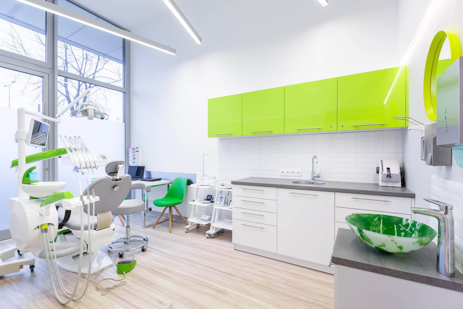Modern dental room with green and white furniture